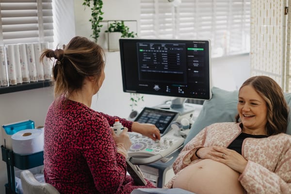A parent having a private pregnancy scan in Barnstaple to illustrate how early you can have a pregnancy scan.